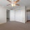 a room with a window and ceiling fan